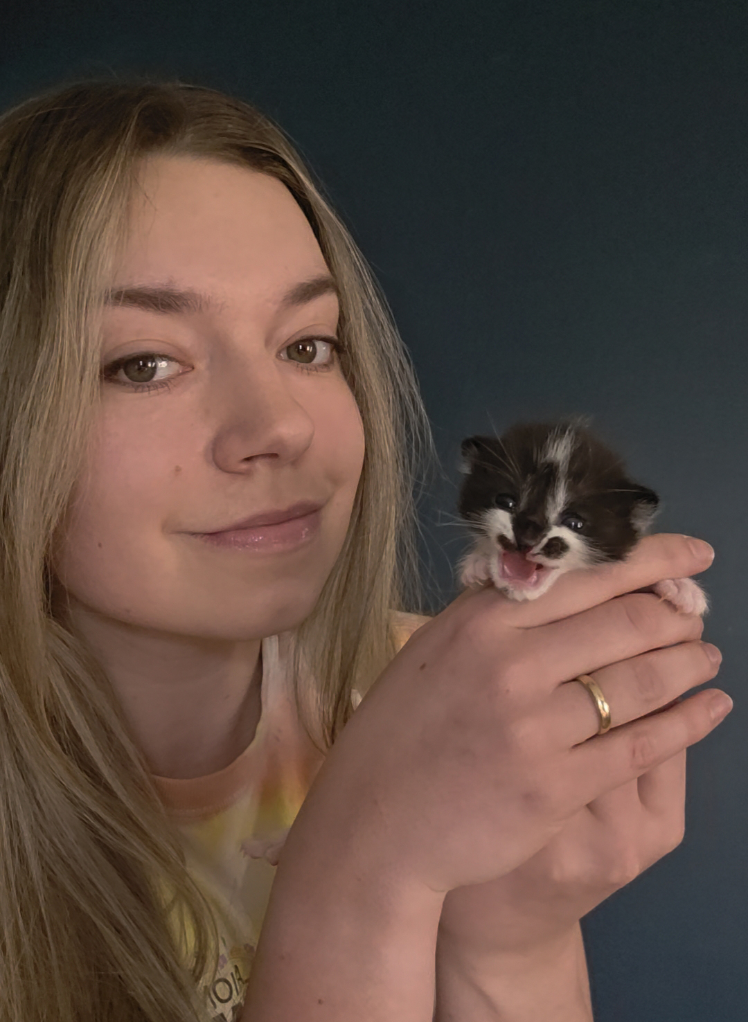 Picture of Alicia with a very small kitten 